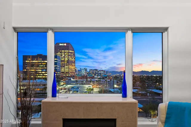 a room with furniture a window and a fireplace