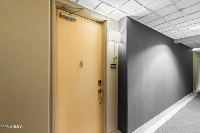 a bathroom with a glass door shower and a sink