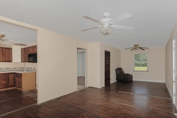 a view of livingroom with furniture and chandelier fan