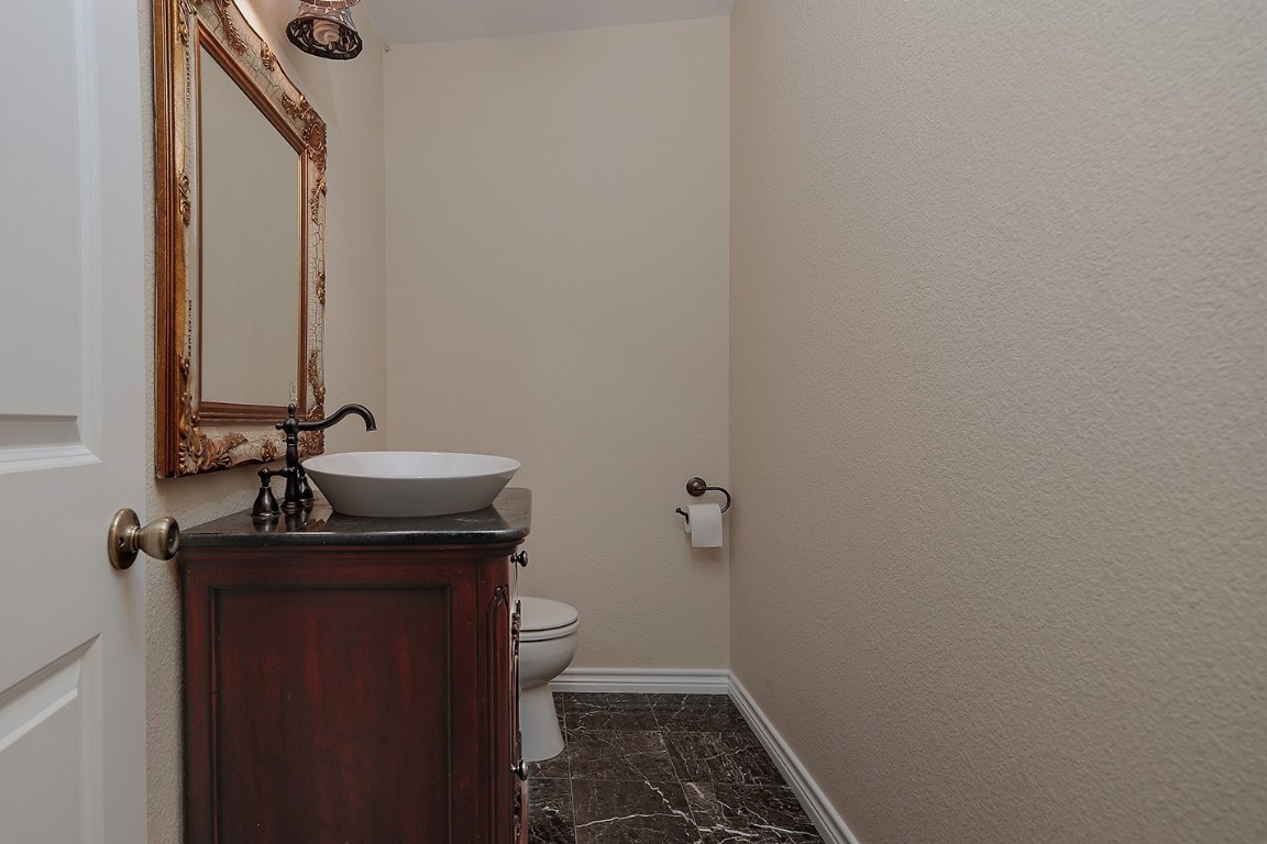 1231 Pruitt Road Spring, TX 77380 - Photo 27 of 37 a bathroom with a sink and a toilet