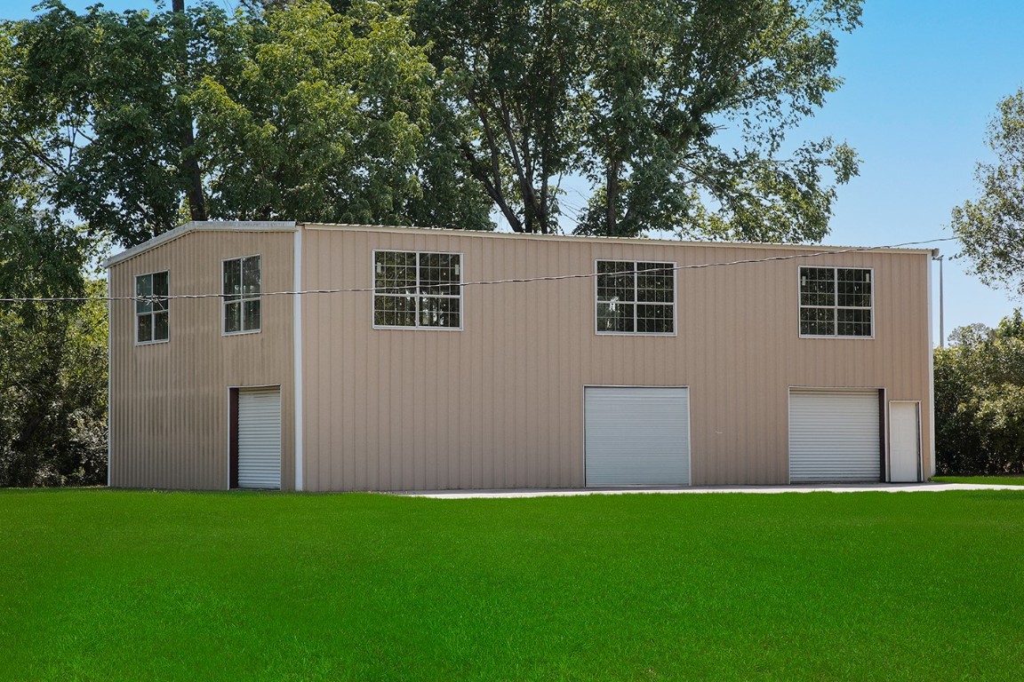 1231 Pruitt Road Spring, TX 77380 - Photo 3 of 37 a front view of house with yard and trees in the background