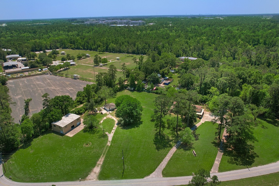 1231 Pruitt Road Spring, TX 77380 - Photo 35 of 37 a view of a lake with a yard