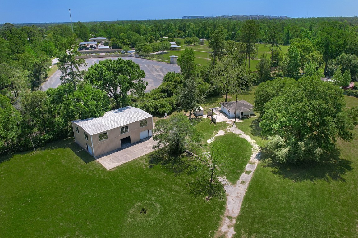 1231 Pruitt Road Spring, TX 77380 - Photo 36 of 37 a view of a house with a yard