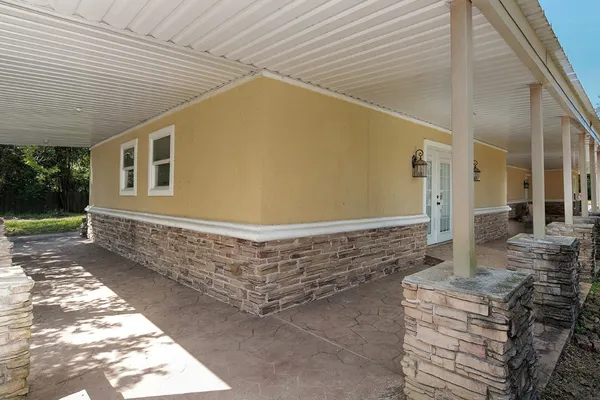 a view of house with backyard