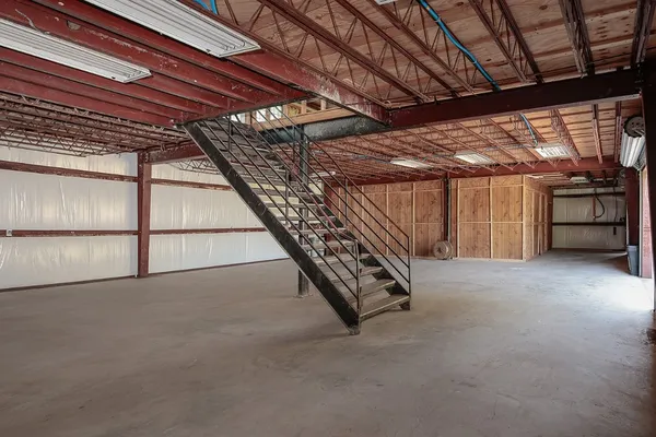 a view of an empty room with a garage