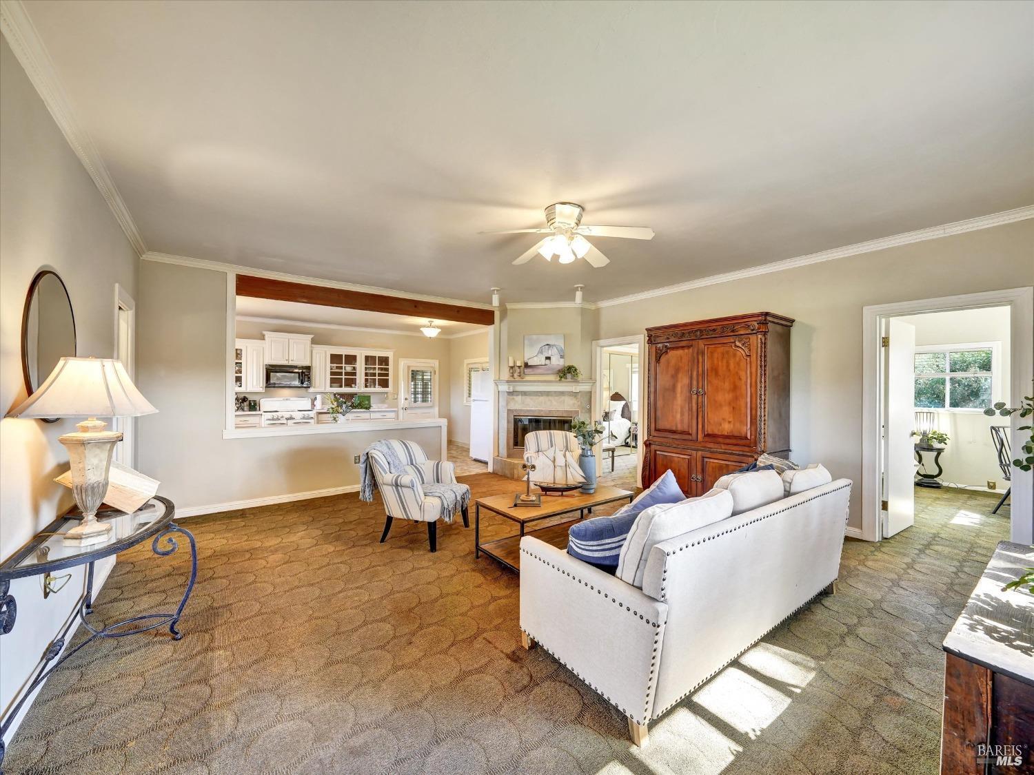 2060 Hagen Road Napa, CA 94558 - Photo 16 of 56 a living room with furniture and a chandelier