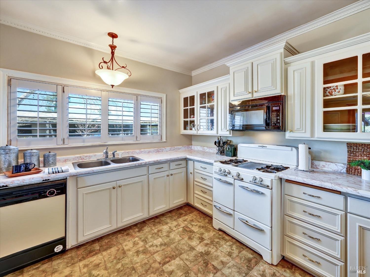 2060 Hagen Road Napa, CA 94558 - Photo 20 of 56 a kitchen with a stove sink and microwave