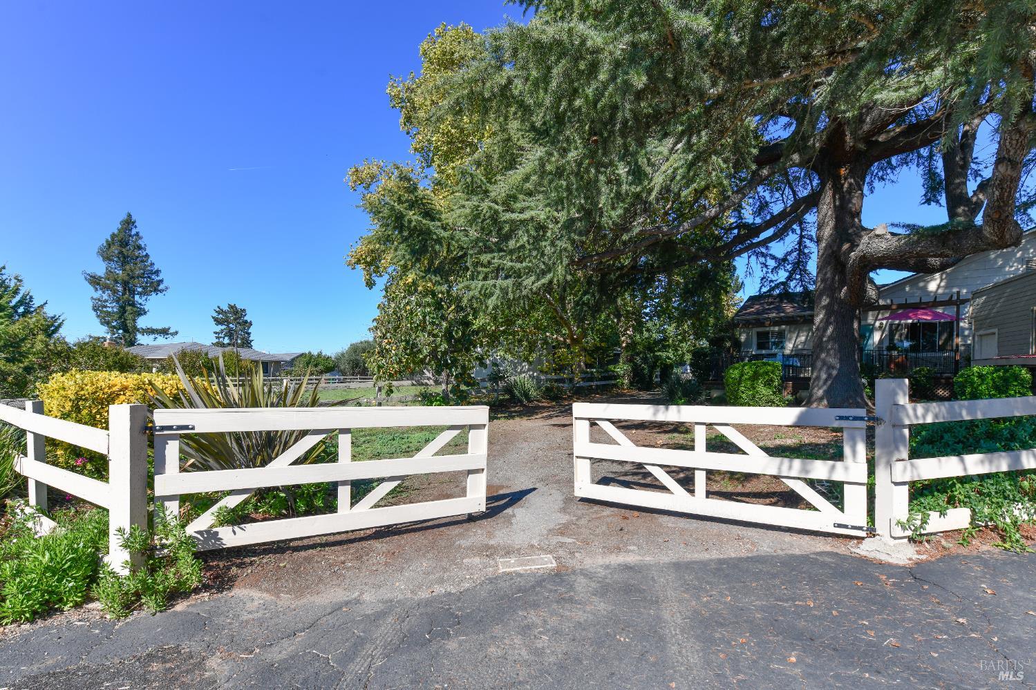 2060 Hagen Road Napa, CA 94558 - Photo 2 of 56 a view of a patio with table and chairs with wooden fence and plants