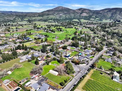an aerial view of residential houses and outdoor space