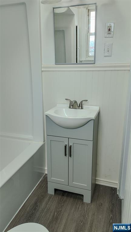 566 Valley Street, Unit 2 Orange, NJ 07050 - Photo 11 of 12 a bathroom with a sink and a mirror
