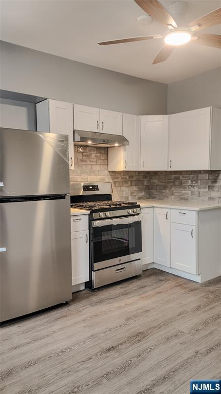 566 Valley Street, Unit 2 Orange, NJ 07050 - Photo 4 of 12 a kitchen with a stove a refrigerator and a sink