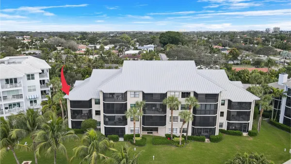 an aerial view of house with yard