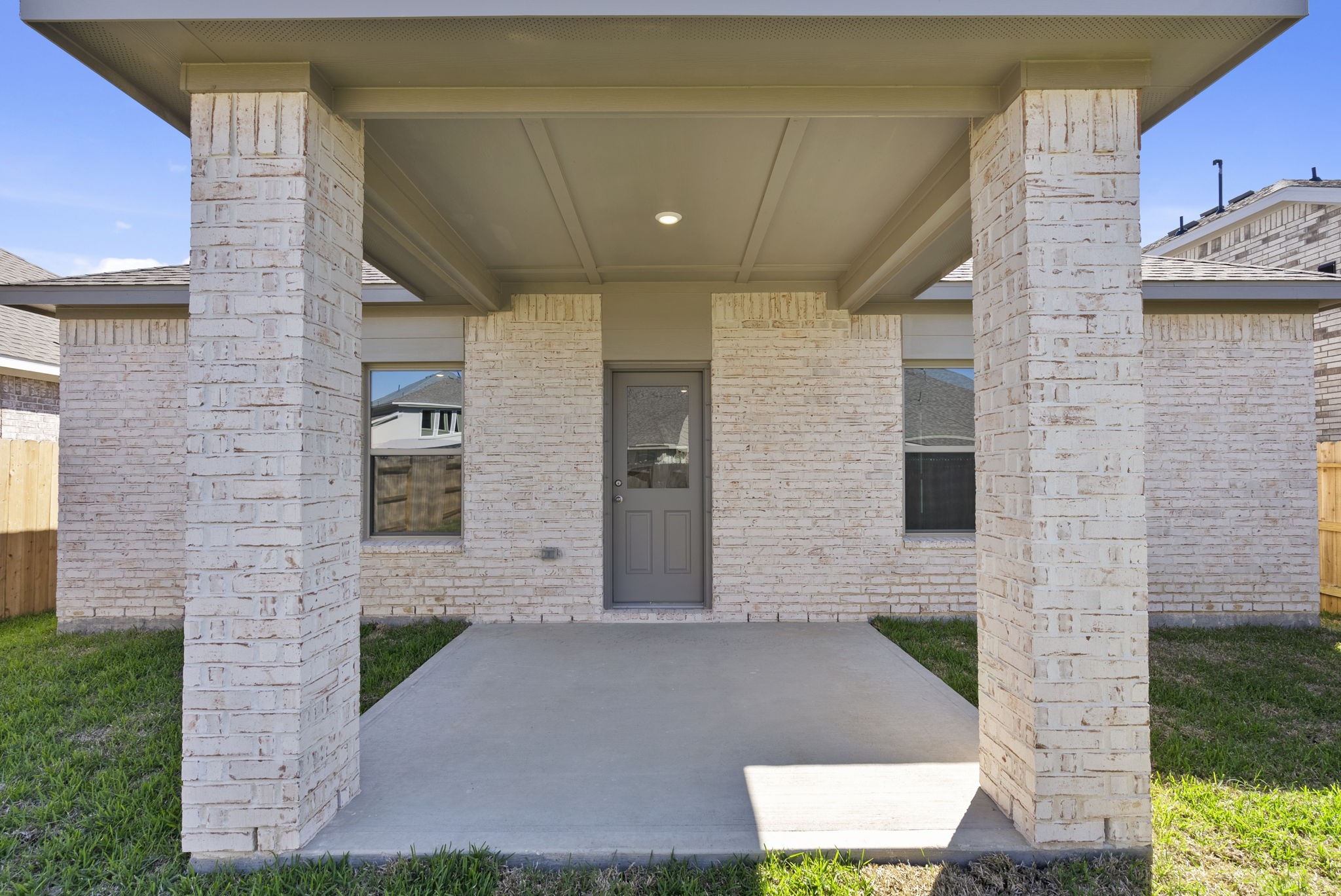 3627 Atlas Pt Lane Angleton, TX 77515 - Photo 24 of 36 a front view of a brick house with a yard