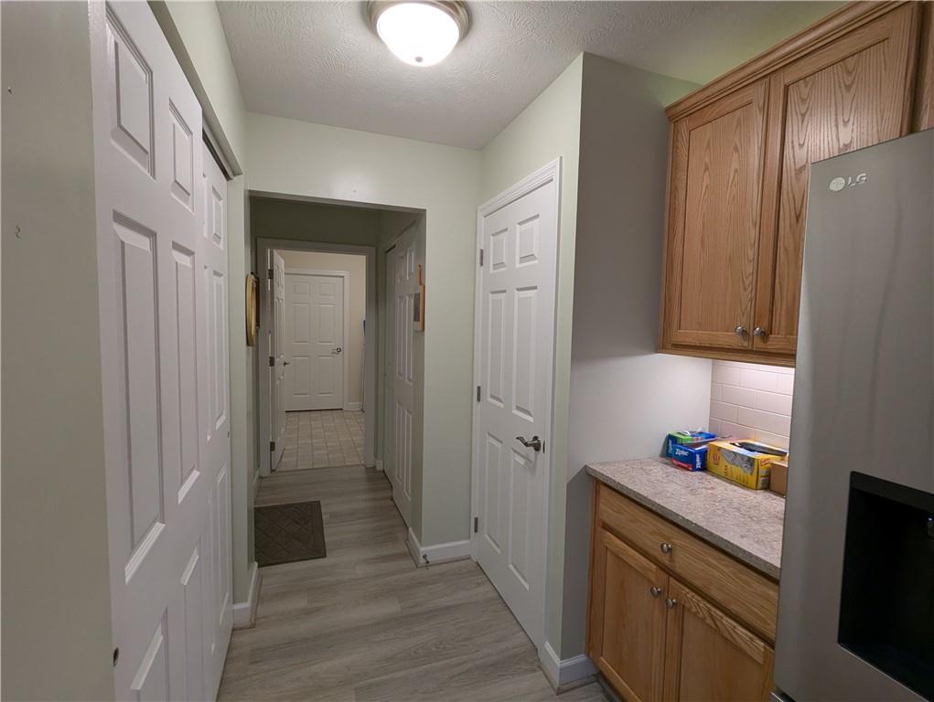 3204 Tudor Drive Butler, PA 16001 - Photo 15 of 35 a bathroom with a sink a mirror and a shower