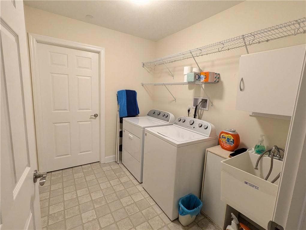 3204 Tudor Drive Butler, PA 16001 - Photo 16 of 35 a utility room with dryer and washer