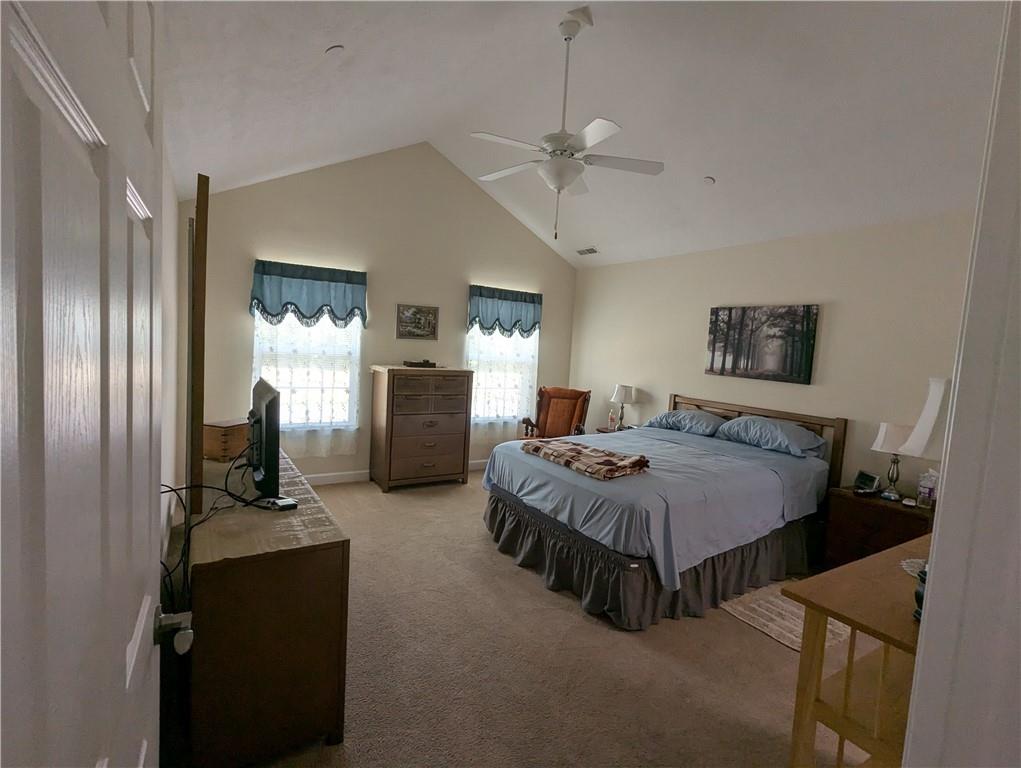 3204 Tudor Drive Butler, PA 16001 - Photo 17 of 35 a bedroom with a bed and a chandelier