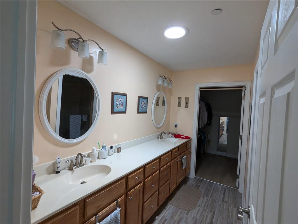 3204 Tudor Drive Butler, PA 16001 - Photo 18 of 35 a bathroom with a double vanity sink and a mirror