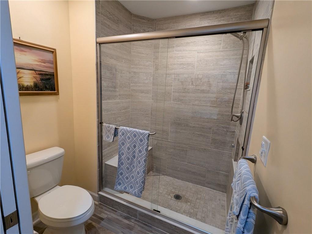 3204 Tudor Drive Butler, PA 16001 - Photo 19 of 35 a white toilet sitting next to a shower