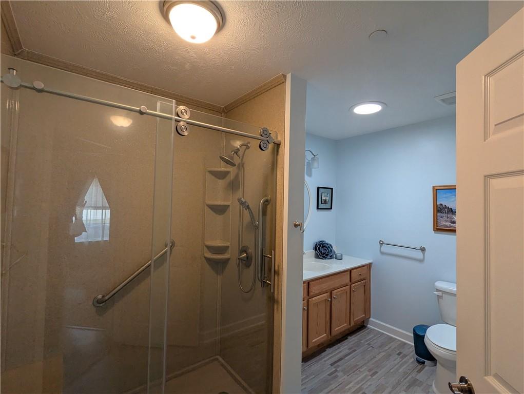 3204 Tudor Drive Butler, PA 16001 - Photo 22 of 35 a bathroom with a shower toilet and sink