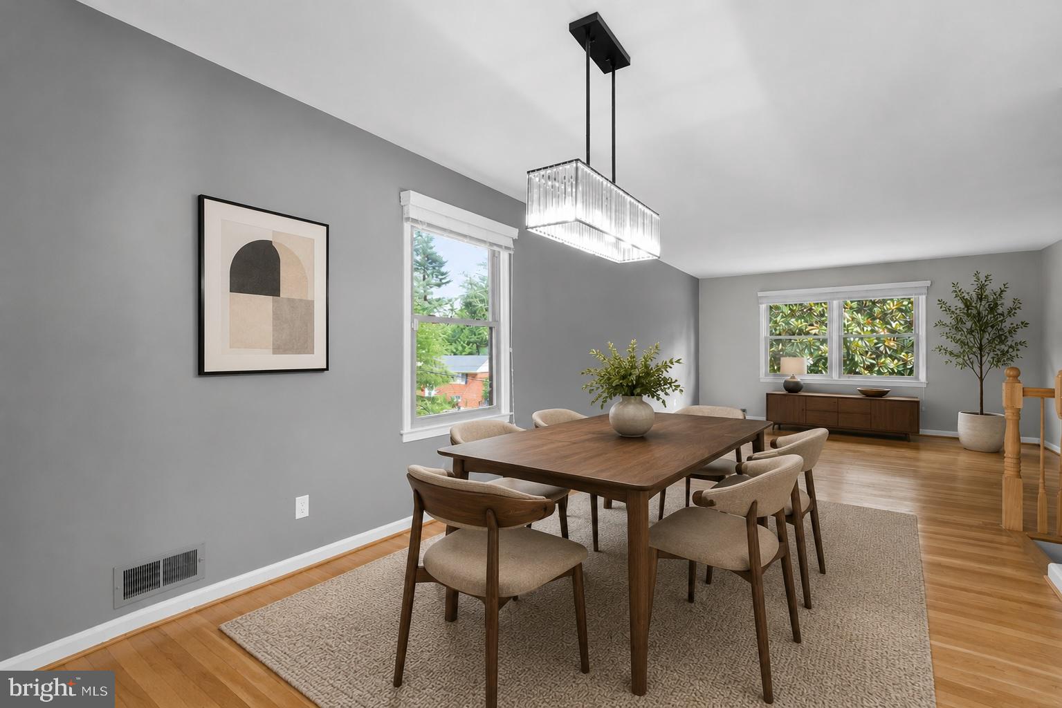 822 Loxford Terrace Silver Spring, MD 20901 - Photo 8 of 61 a view of a dining room and livingroom with furniture wooden floor a chandelier