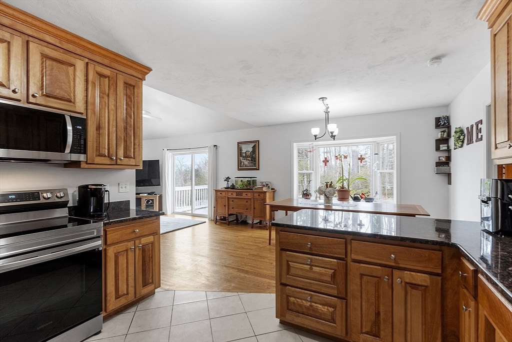 1 Gary Road Templeton, MA 01468 - Photo 13 of 33 a kitchen with stainless steel appliances granite countertop a stove and cabinets