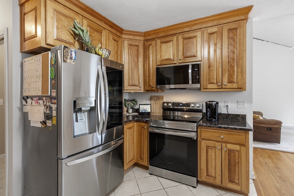 1 Gary Road Templeton, MA 01468 - Photo 16 of 33 a kitchen with stainless steel appliances granite countertop a refrigerator stove top oven a sink and dishwasher