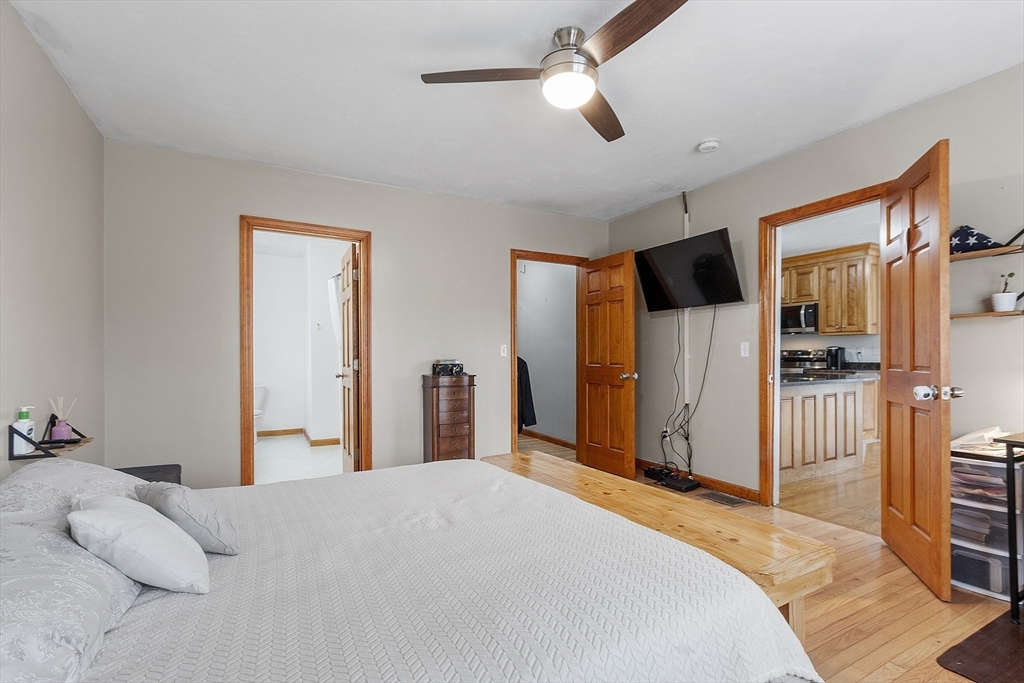 1 Gary Road Templeton, MA 01468 - Photo 20 of 33 a bedroom with a bed and a chandelier