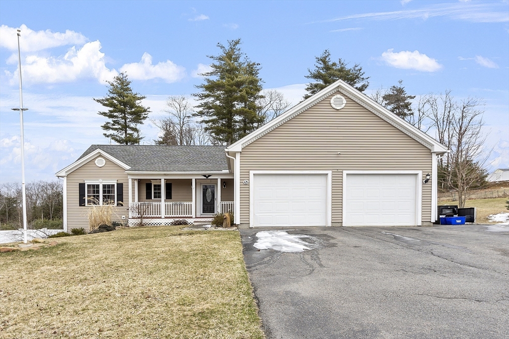 1 Gary Road Templeton, MA 01468 - Photo 2 of 33 a front view of a house with a yard and garage