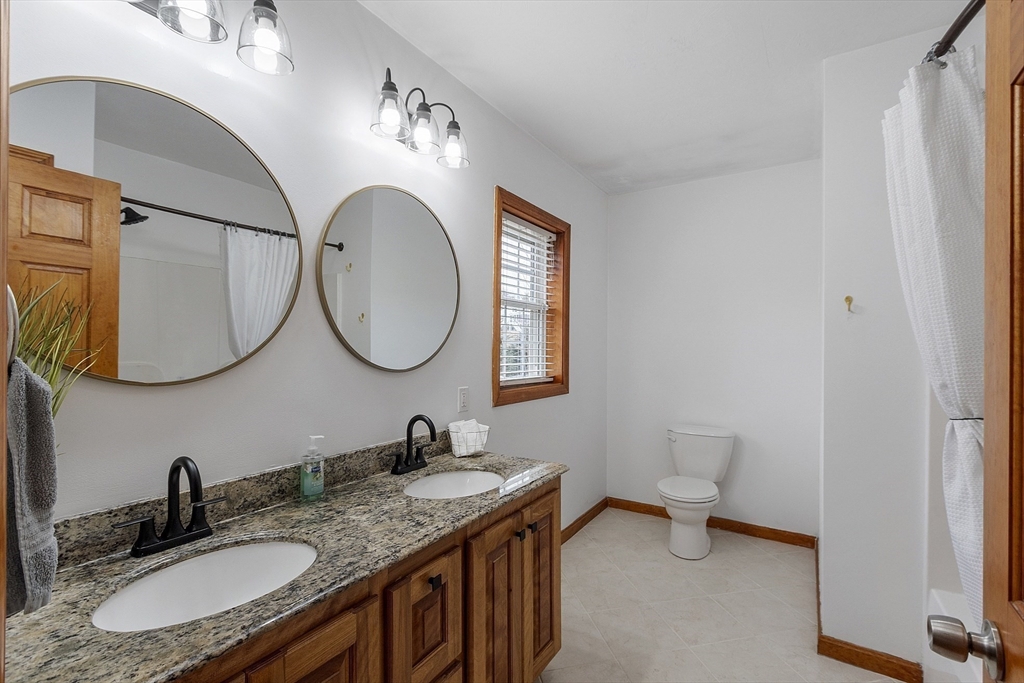 1 Gary Road Templeton, MA 01468 - Photo 22 of 33 a bathroom with a granite countertop double vanity sink and a mirror