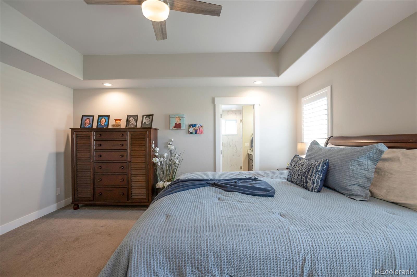 3711 Harrier Hawk Road Dacono, CO 80514 - Photo 17 of 40 a bedroom with a bed and a closet