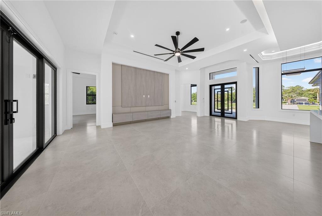 522 17th Street Southwest Naples, FL 34117 - Photo 16 of 50 a view of an empty room with a window and wooden floor