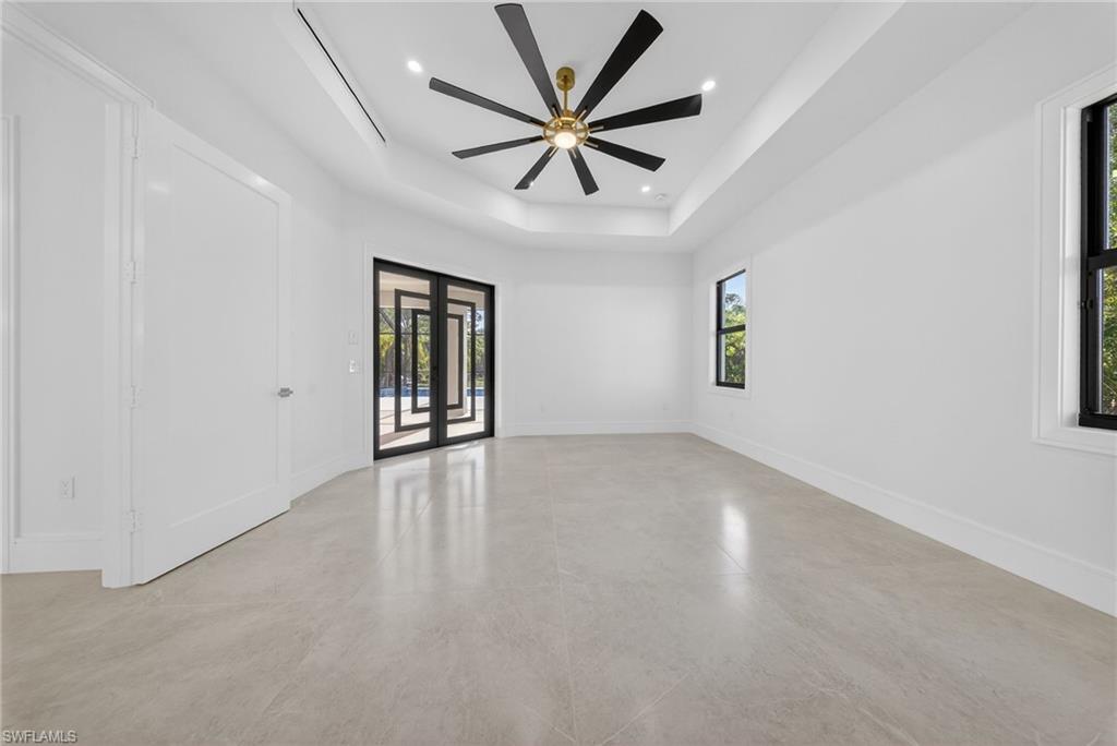 522 17th Street Southwest Naples, FL 34117 - Photo 37 of 50 wooden floor in an empty room with a window