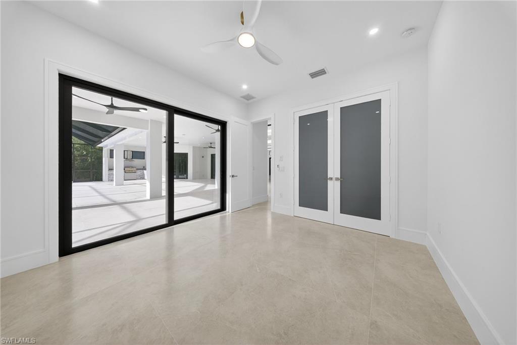 522 17th Street Southwest Naples, FL 34117 - Photo 39 of 50 a view of an empty room with a sliding door