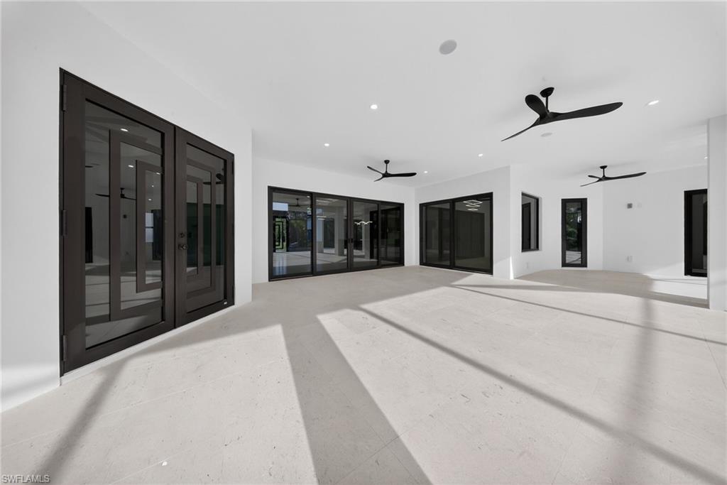 522 17th Street Southwest Naples, FL 34117 - Photo 41 of 50 a large white room with large windows