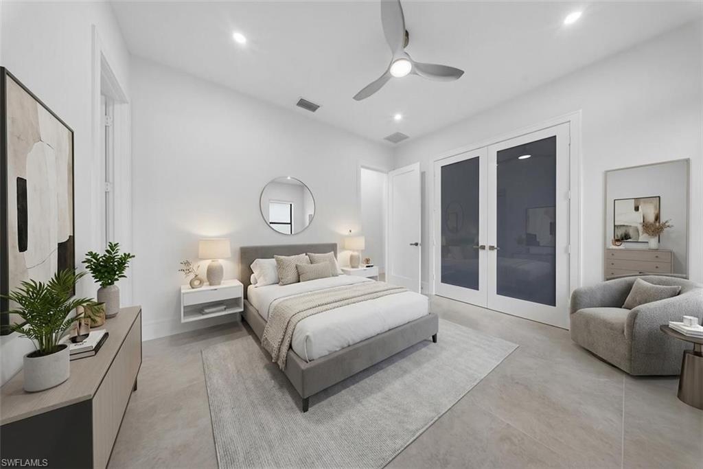 522 17th Street Southwest Naples, FL 34117 - Photo 9 of 50 a spacious bedroom with a bed and ceiling fan