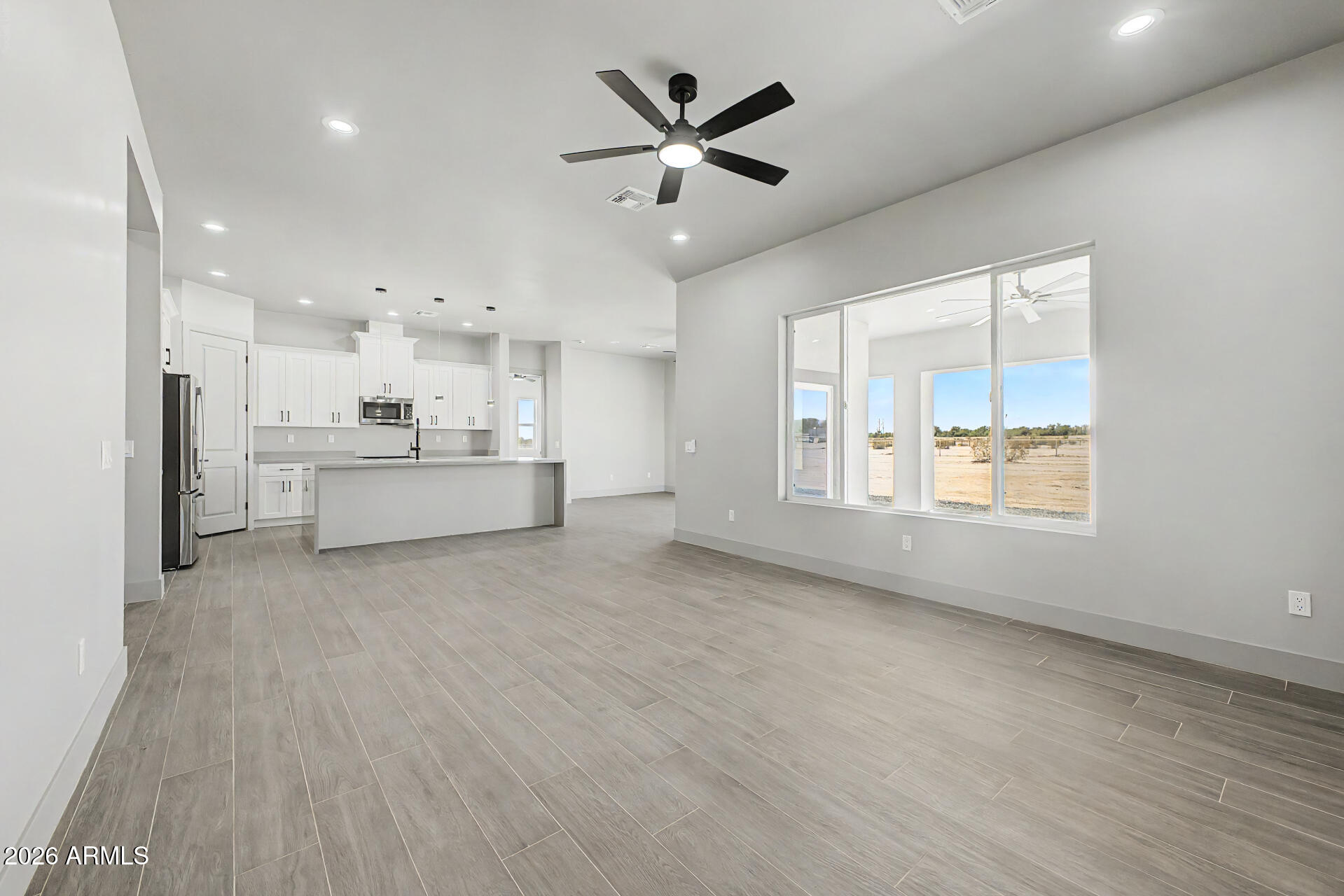 40461 West Robles Road Stanfield, AZ 85172 - Photo 23 of 54 a view of an empty room with window and cabinet