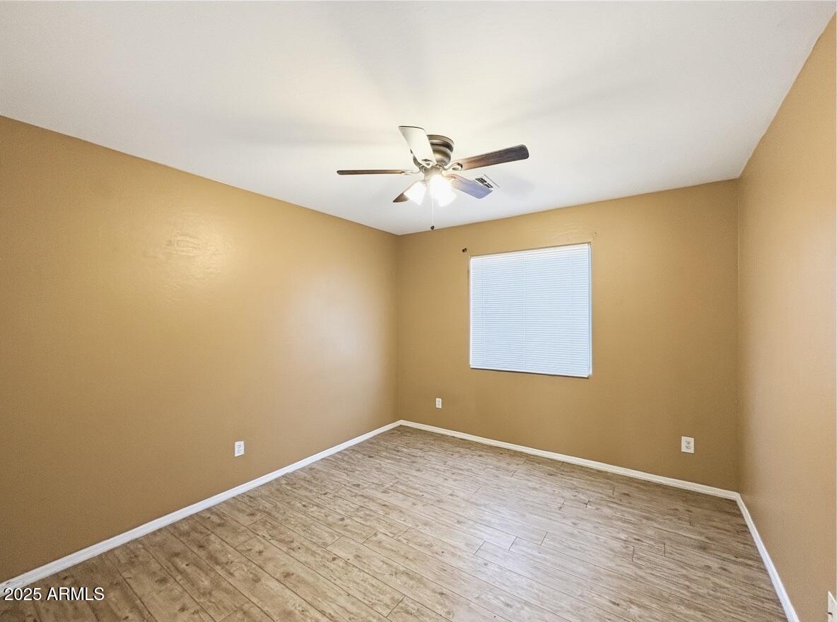 2330 West Maldonado Road Phoenix, AZ 85041 - Photo 13 of 17 a view of an empty room with a window