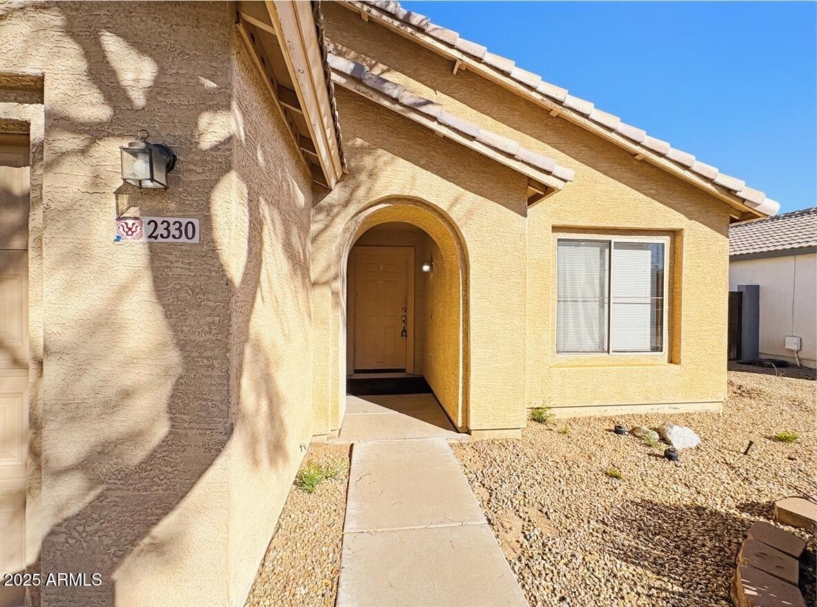 2330 West Maldonado Road Phoenix, AZ 85041 - Photo 2 of 17 a front view of a house