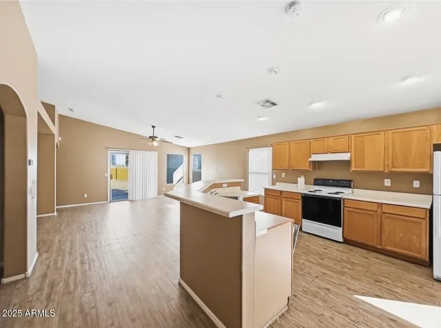 a kitchen with stainless steel appliances granite countertop a sink and cabinets