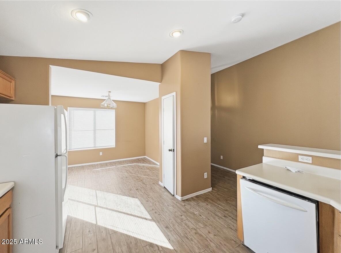 2330 West Maldonado Road Phoenix, AZ 85041 - Photo 4 of 17 a view of storage and utility room with wooden floor