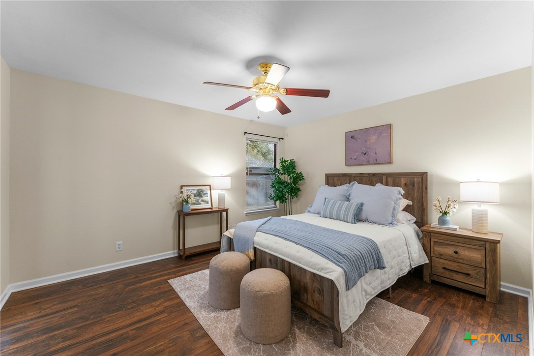 2504 Lazy Ridge Drive Killeen, TX 76543 - Photo 14 of 27 a bedroom with bed and wooden floor
