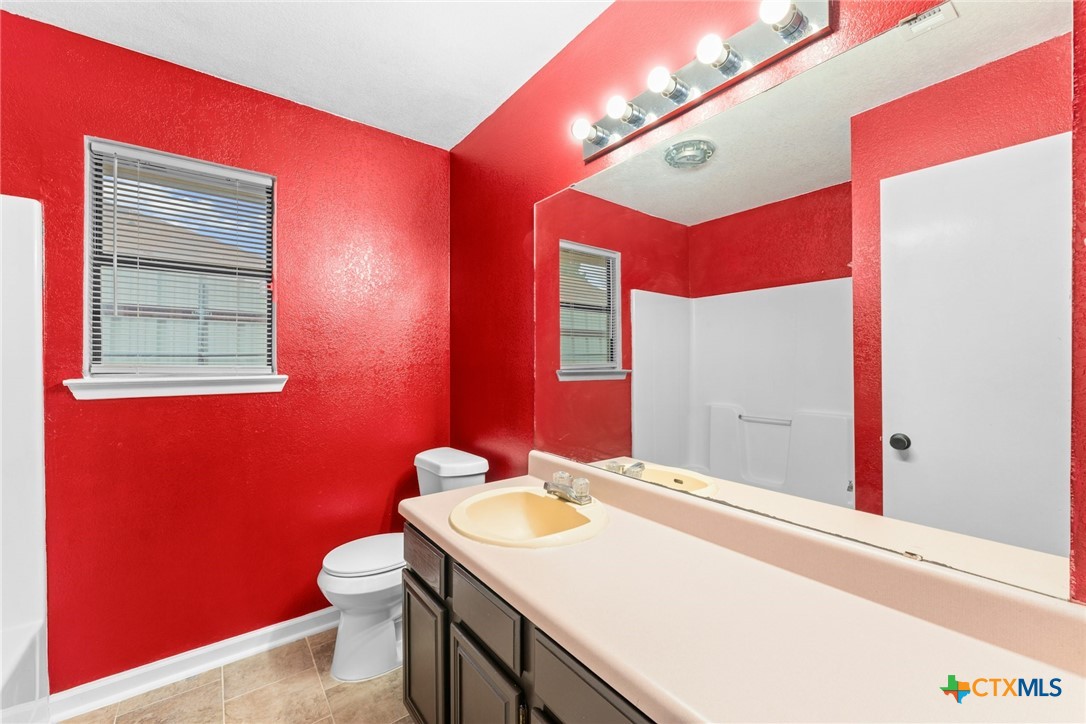 2504 Lazy Ridge Drive Killeen, TX 76543 - Photo 22 of 27 a bathroom with a sink a vanity and a mirror