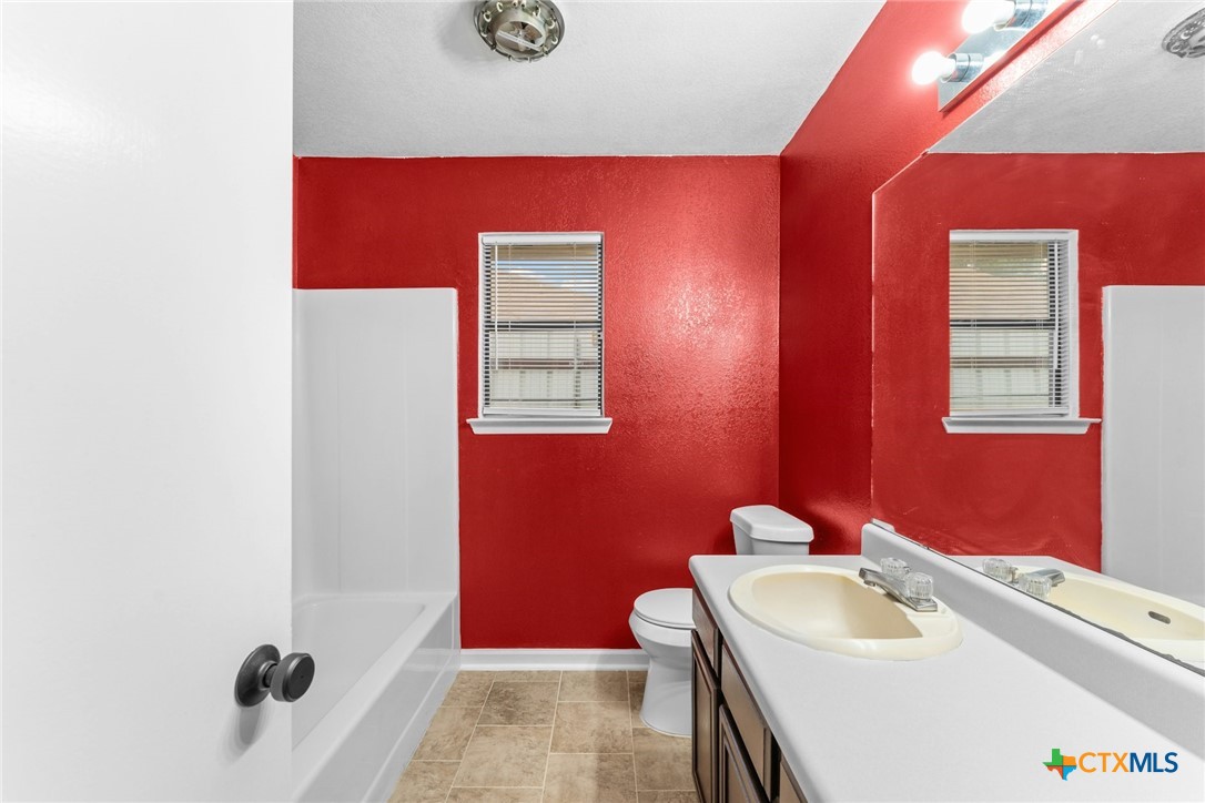 2504 Lazy Ridge Drive Killeen, TX 76543 - Photo 23 of 27 a bathroom with a sink and a mirror