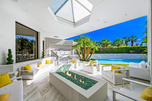 a view of a swimming pool with a patio