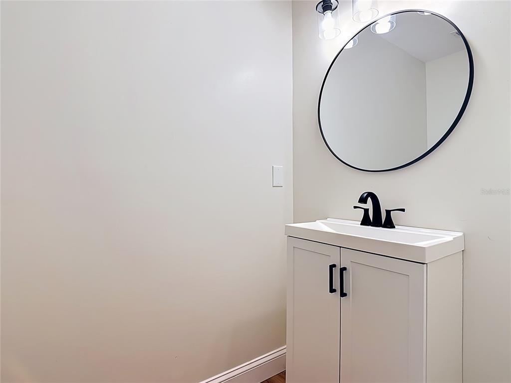 7925 Lake Mabel Loop Road Lake Wales, FL 33898 - Photo 71 of 97 a bathroom with a sink and a mirror
