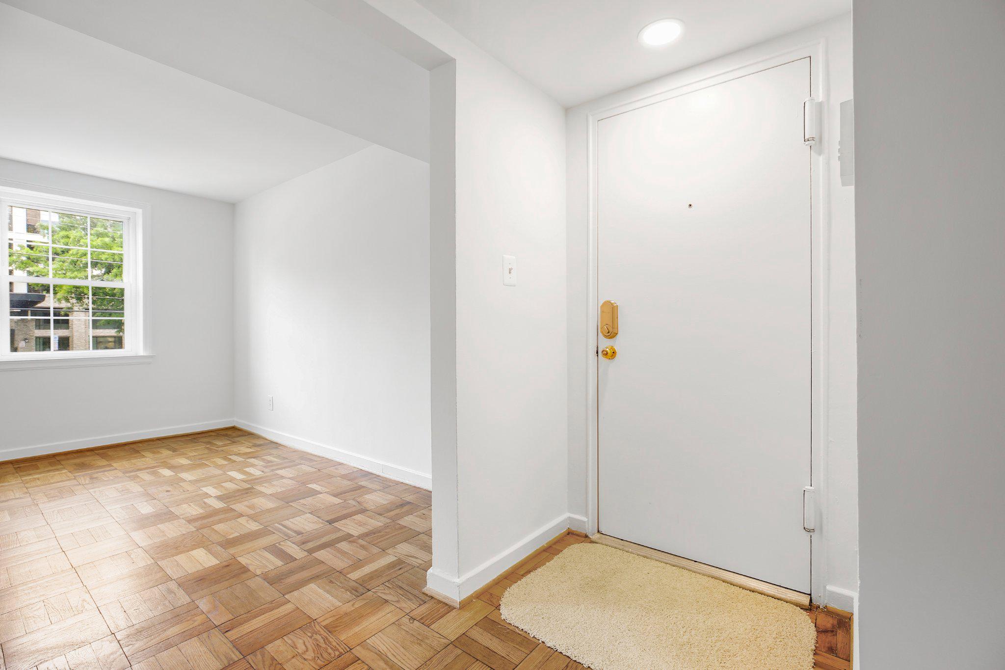 2202 Colston Drive, Unit 102 Silver Spring, MD 20910 - Photo 7 of 38 an empty room with windows