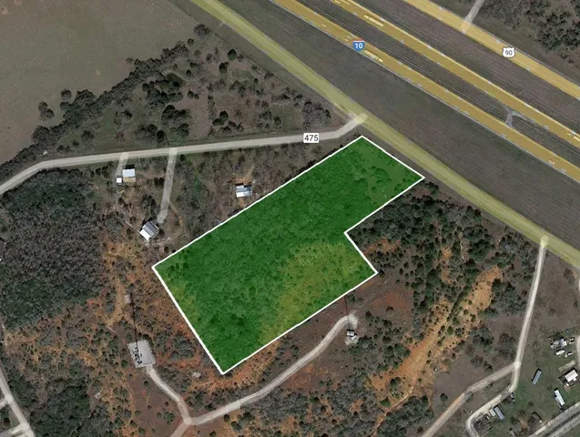 a view of a yard with wooden floor