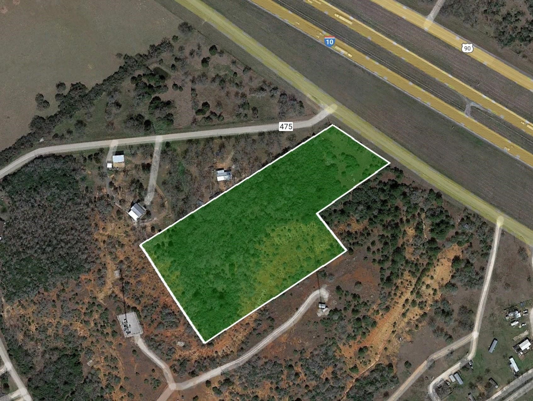 0 East I-10 Luling, TX 78648 - Photo 8 of 8 a view of a yard with wooden floor