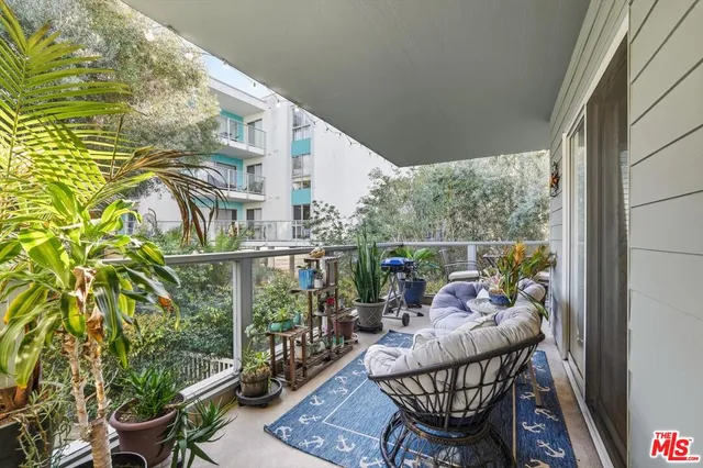 a view of balcony with furniture
