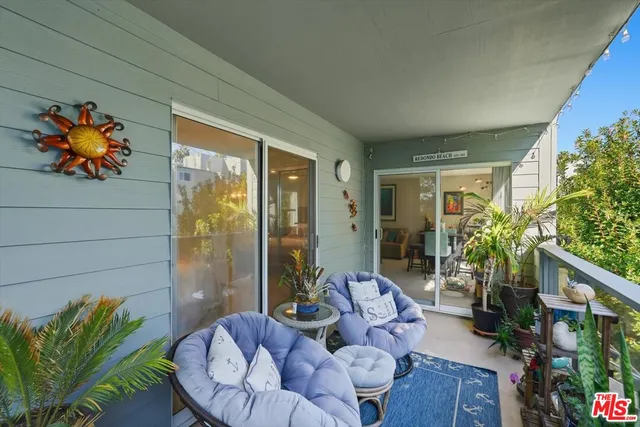 a living room with patio furniture